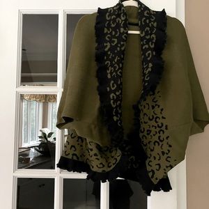 Sweater cape with arm holes